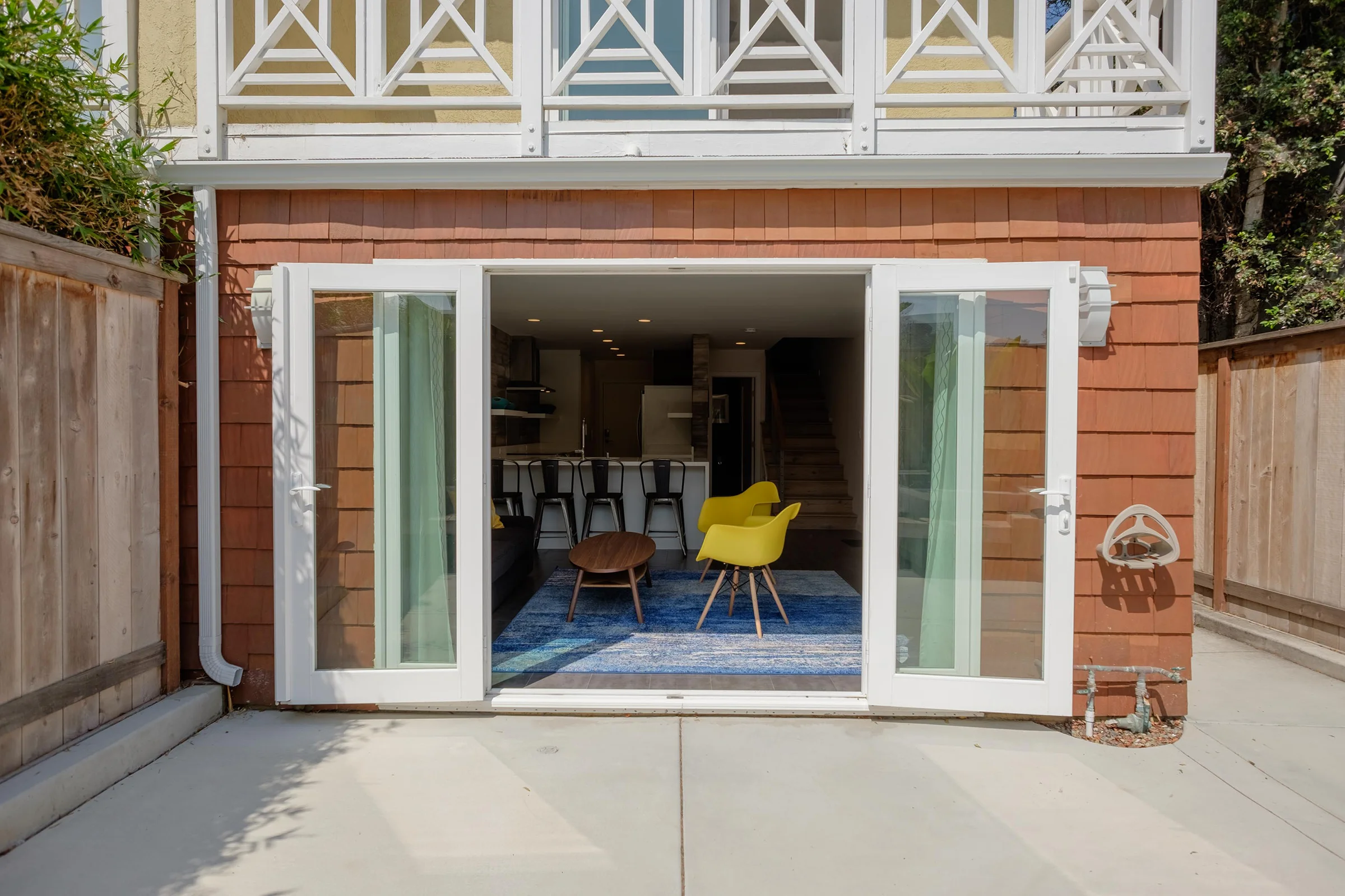 Updated front facade with french doors that connect the living room to the front patio.